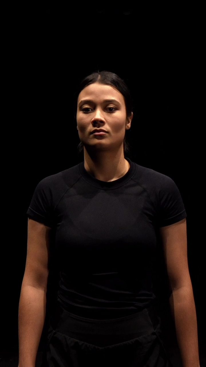 Saarah Karriem under a spotlight